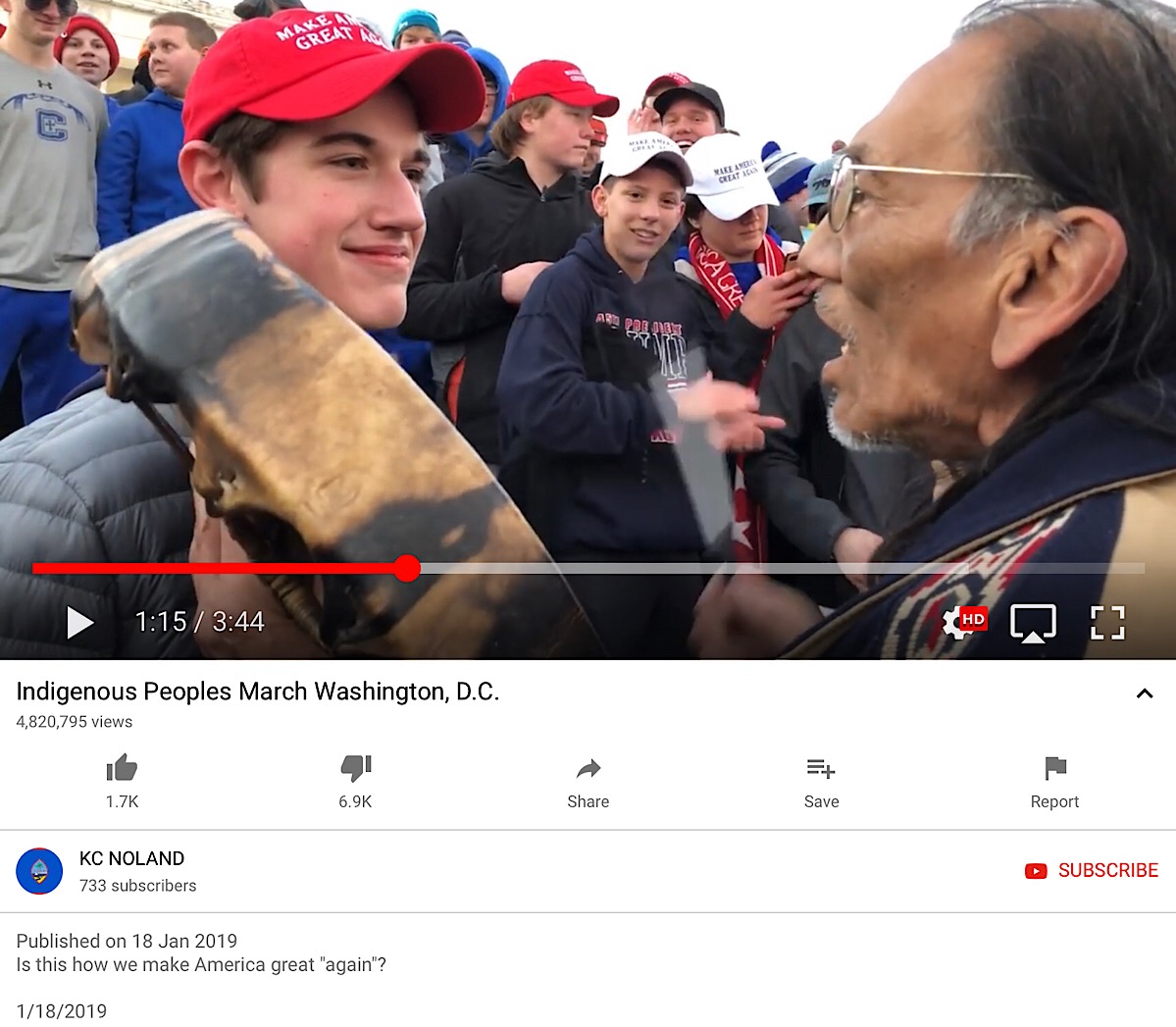 A screenshot of the original YouTube video showing the encounter between Covington Catholic High School students and a native American man.