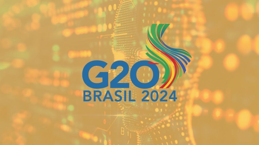 G20 Brasil 2024 logo with colorful abstract design and blurred background.