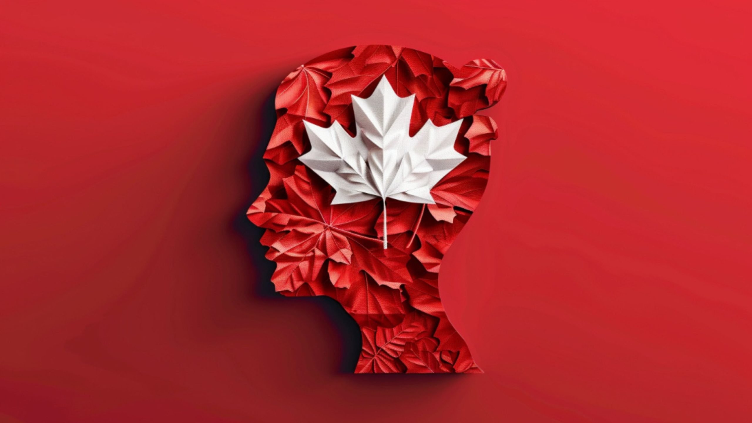 Silhouette of a head made of red leaves with a white maple leaf on a red background.