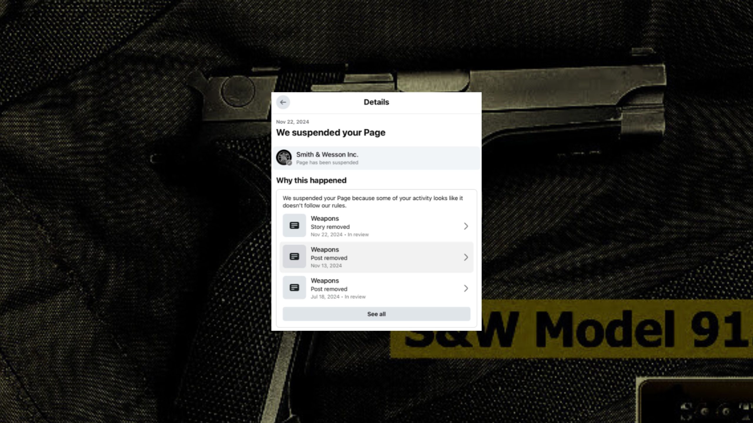 Notification of a suspended page on a social media platform due to content violations related to weapons, with a handgun in the background.