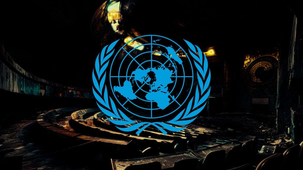 Blue United Nations emblem over a dimly lit, abandoned conference hall.