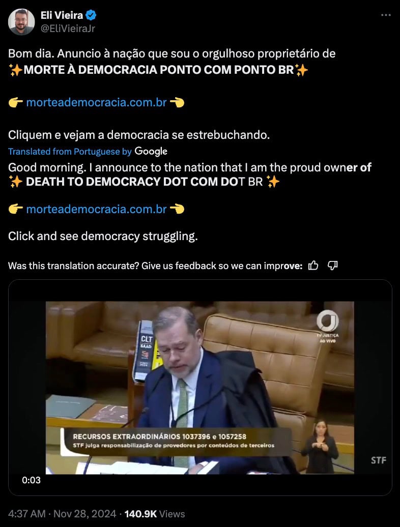 A tweet by Eli Vieira announcing ownership of the domain "morteademocracia.com.br" with a video clip showing a man sitting in a courtroom setting, wearing a suit. The text includes a translation from Portuguese to English.