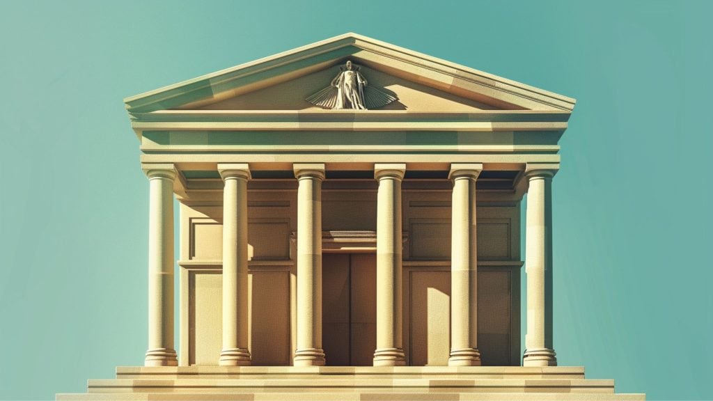 Neoclassical building with columns and a triangular pediment, featuring a sculpted figure at the top.