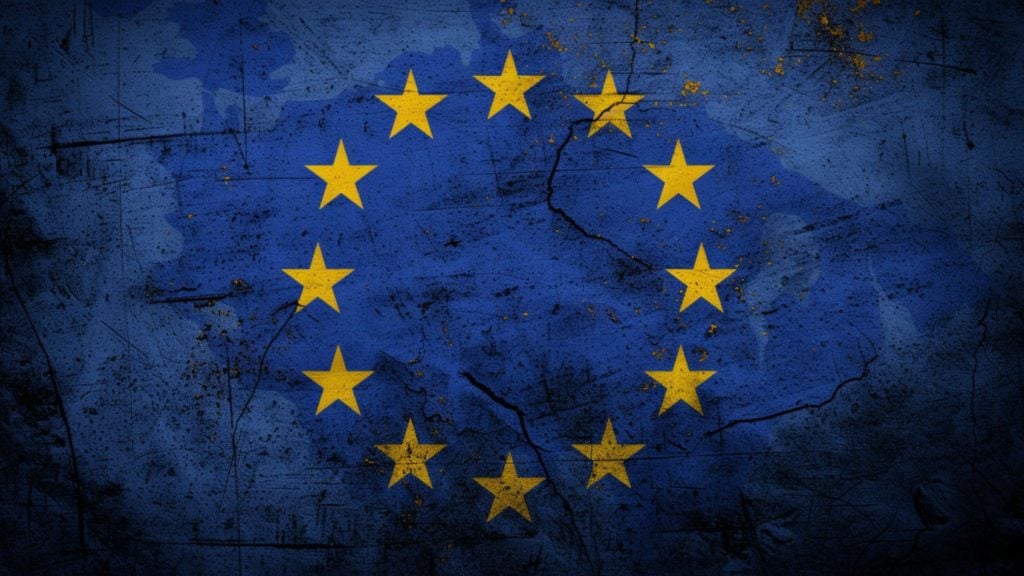 Grunge-style European Union flag with a blue background and twelve yellow stars.