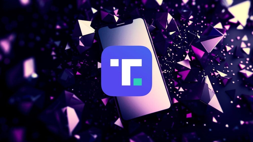 A smartphone surrounded by purple geometric shapes with a blue app icon on the screen.