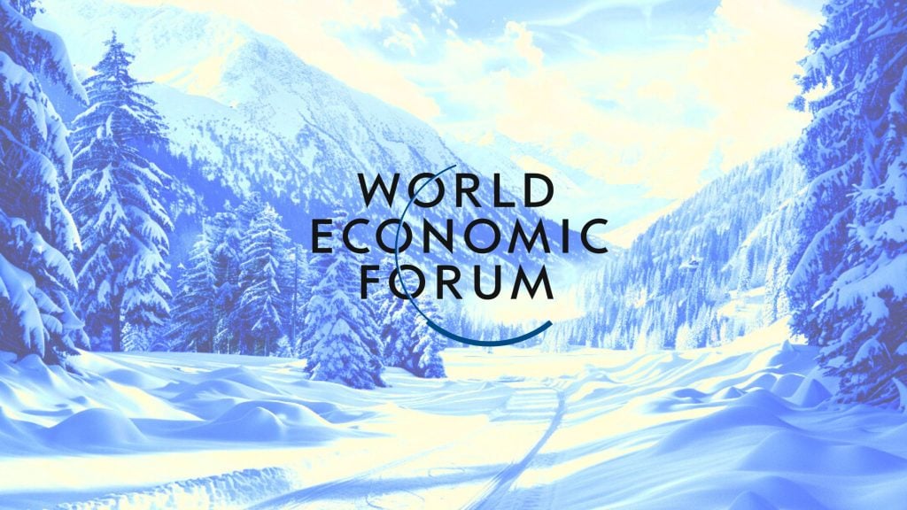 Snow-covered landscape with the "World Economic Forum" logo.