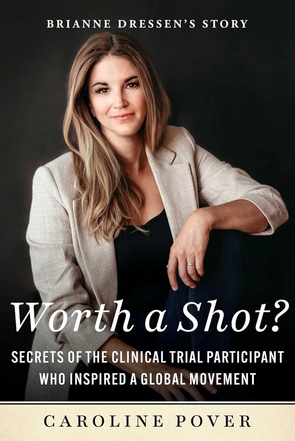 Cover of the book "Worth a Shot?" featuring a woman in a beige blazer with text attributing the story to Brianne Dressen and authored by Caroline Pover.