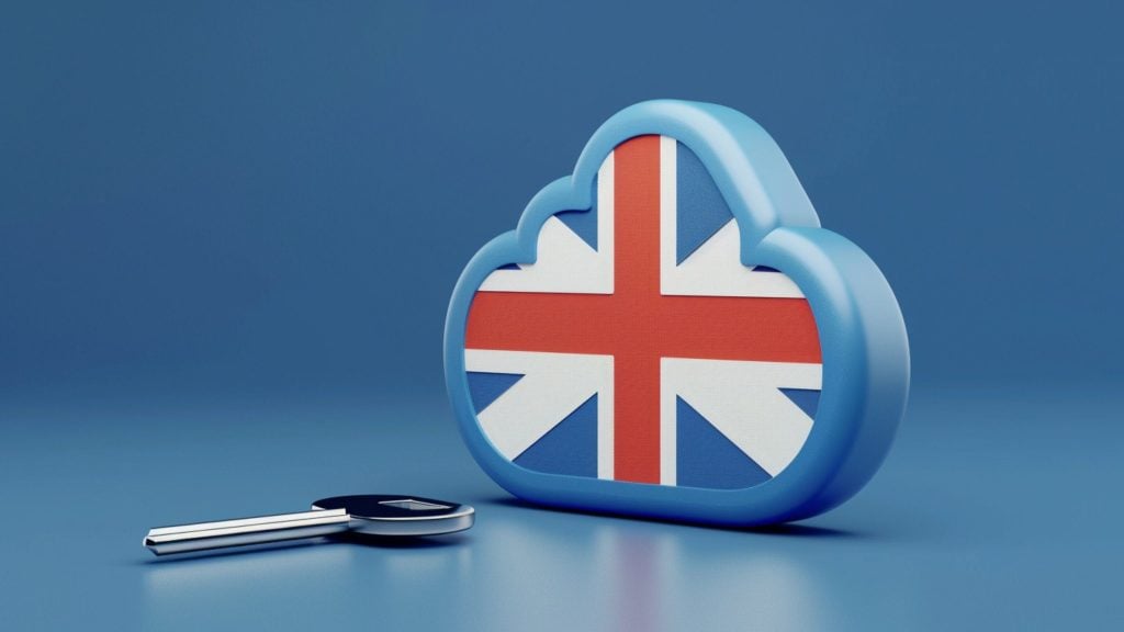 A 3D illustration of a cloud shape with the Union Jack flag design on it, next to a silver key on a blue background.