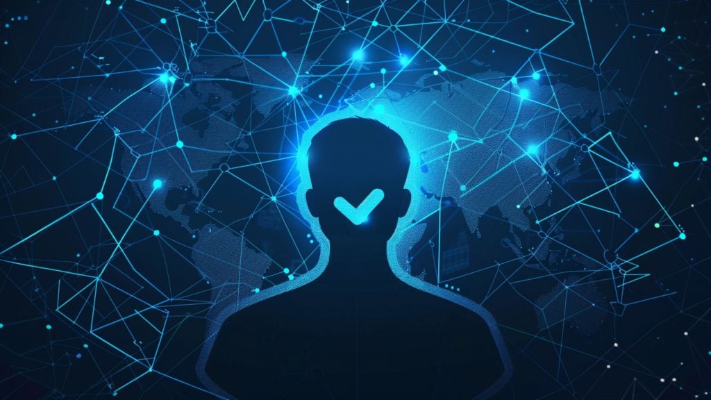 Silhouette of a person with a glowing checkmark over the face, set against a digital network background with world map and interconnected points in blue tones