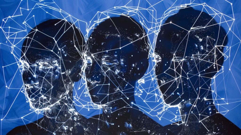 Three human head sculptures with dark surfaces covered in white interconnected lines and dots, resembling constellations against a blue background.