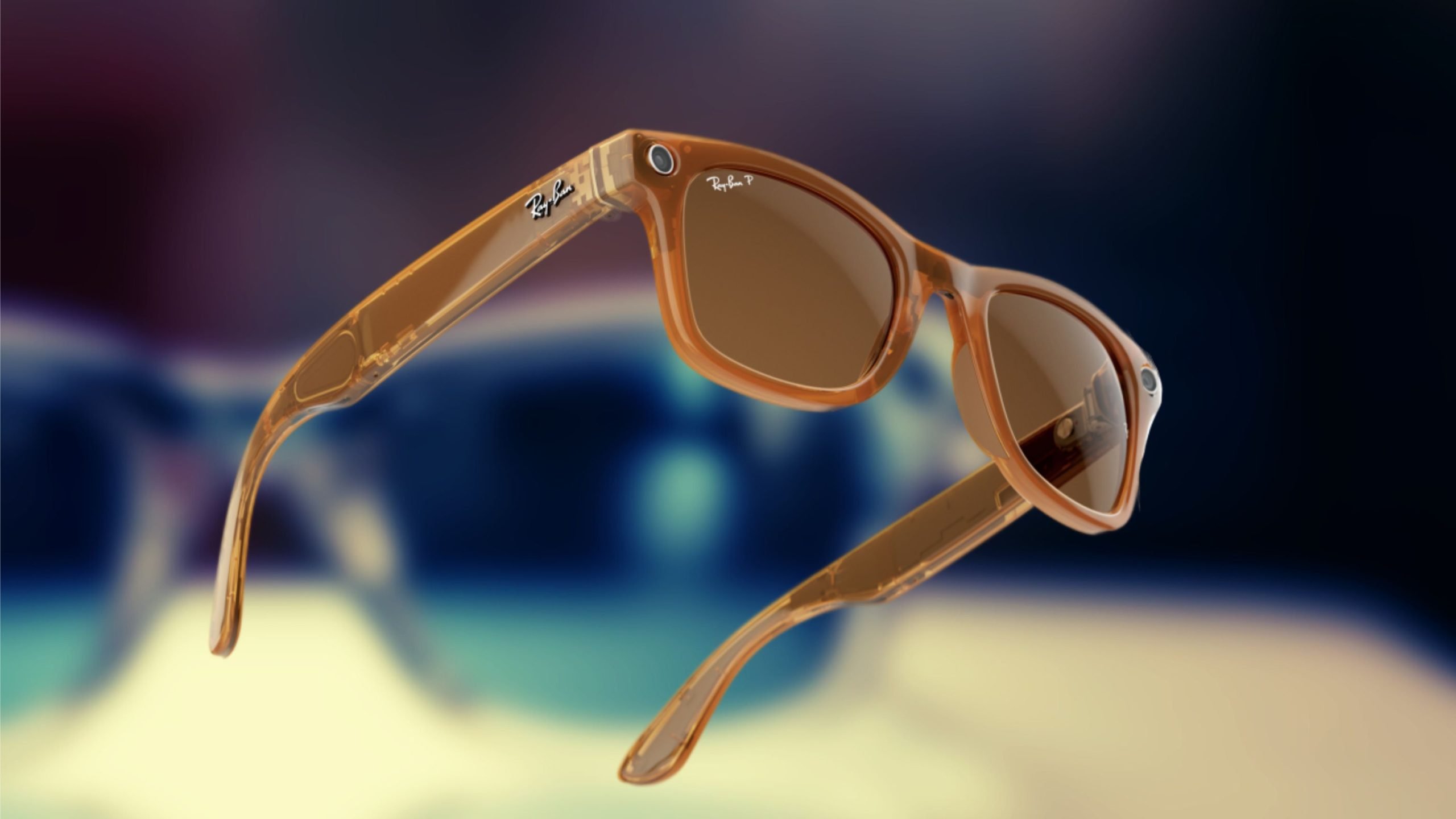 Close-up of translucent amber-colored Ray-Ban sunglasses with brown lenses, showing detailed frame and camera on the top corner, against a blurred multi-colored background.