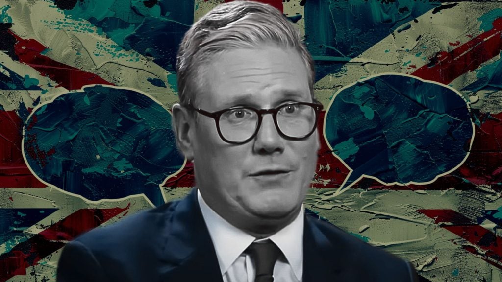 Starmer wearing glasses, a suit, and tie in front of a textured British flag background with two empty speech bubbles on either side of his head.