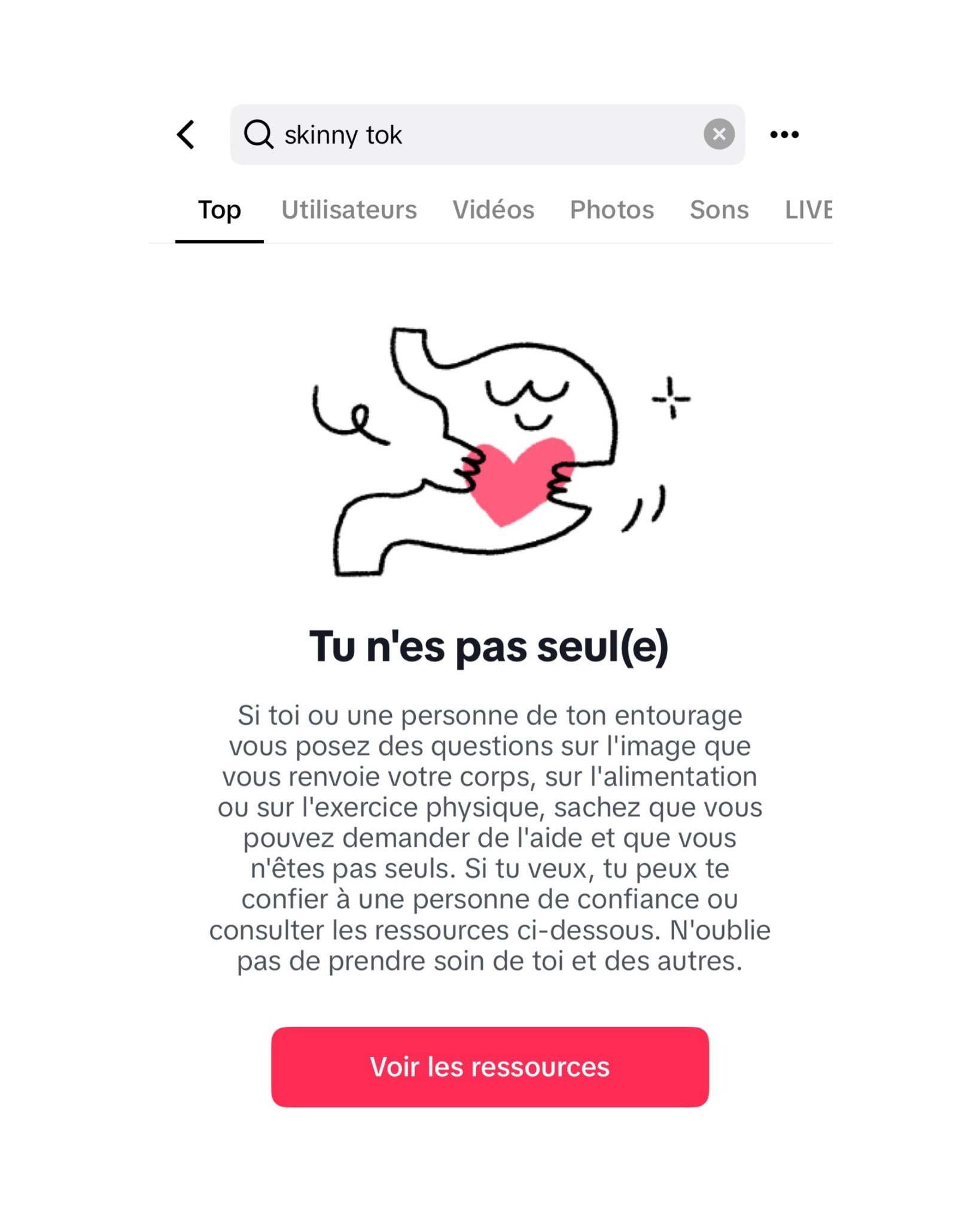 Search result for "skinny tok" showing a message in French with a simple illustration of a stomach hugging a red heart, and text encouraging people not to feel alone and to seek help or resources related to body image, nutrition, or exercise.