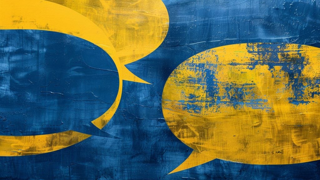 Abstract image of large yellow speech bubbles on a textured blue background with visible brush strokes and distressed areas.