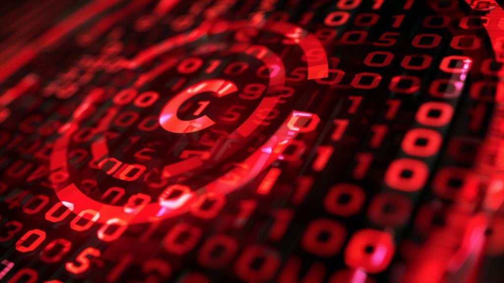Red digital binary code overlaid with a large red padlock icon symbolizing cybersecurity or data protection.