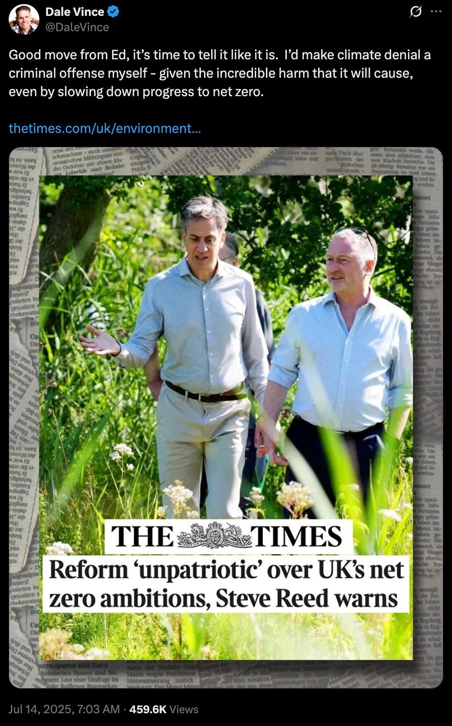 Two men walking outdoors in a green grassy area, one speaking with hand gestures, with a newspaper headline overlay stating 'THE TIMES Reform ‘unpatriotic’ over UK’s net zero ambitions, Steve Reed warns'