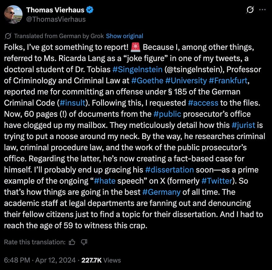 Dark-themed screenshot of a translated verified social media post in which the user complains about being reported for insult under German law, mentions a doctoral student and a law professor, says 60 pages of prosecutorial documents arrived, lists hashtags (e.g., #insult, #access, #public, #jurist, #dissertation, #hate, #Germany), and shows a timestamp of Apr 12, 2024, 6:48 PM with 227.7K views.