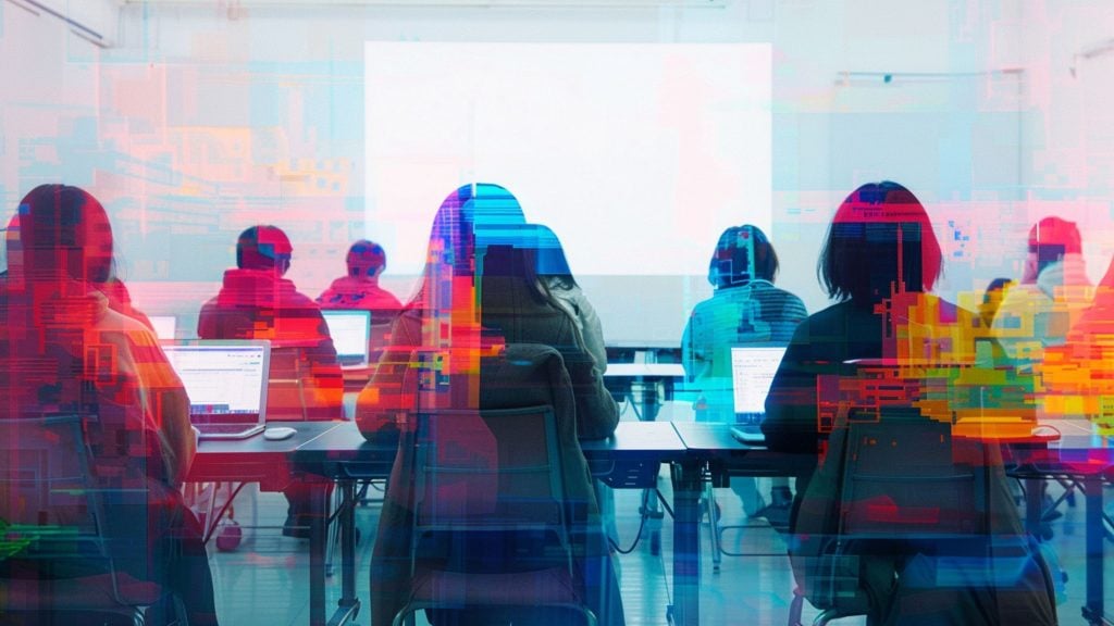 Students seated at desks using laptops and facing a blank projection screen in a classroom, shown from behind with colorful digital glitch overlays.