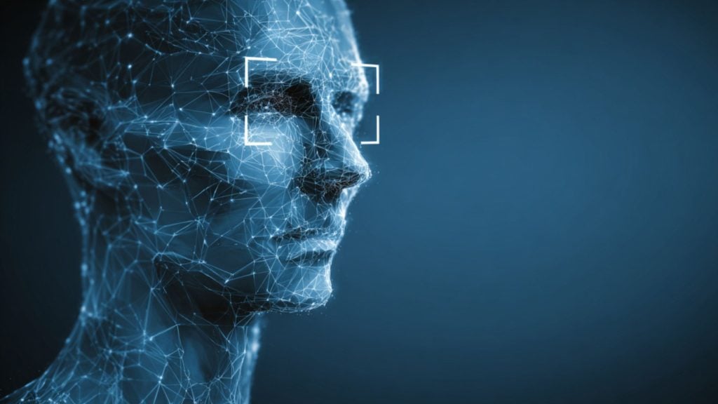 Blue wireframe human head in profile composed of glowing network nodes and connecting lines, with a white rectangular face-recognition frame around the eye area against a dark blue background.
