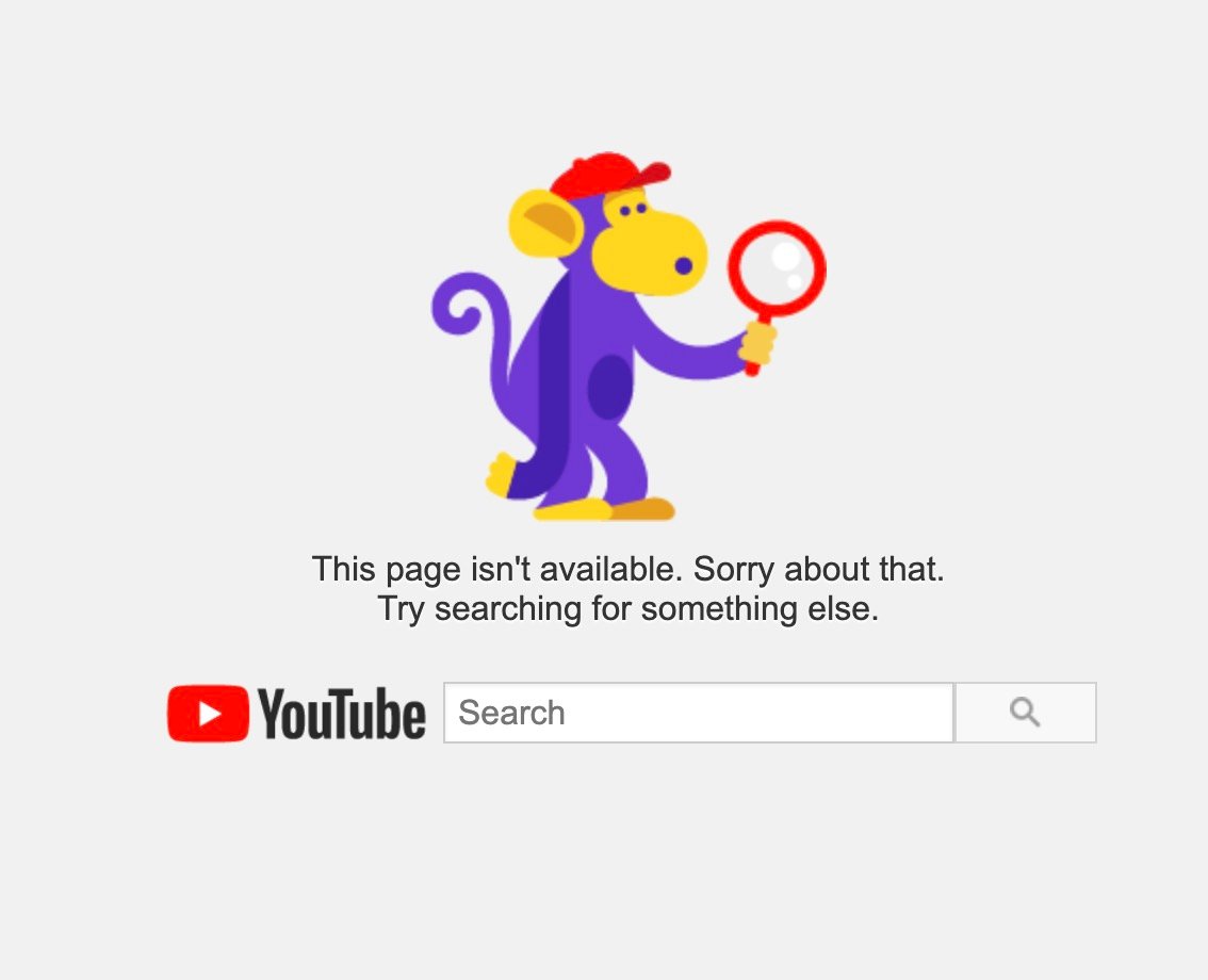 Cartoon purple monkey wearing a red cap holding a magnifying glass above the message "This page isn't available. Sorry about that. Try searching for something else." with the YouTube logo and a search bar below on a pale gray background.