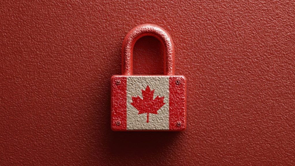 Red textured padlock painted with a white central stripe and a red maple leaf (Canadian flag) on its front, centered against a matching textured red background.
