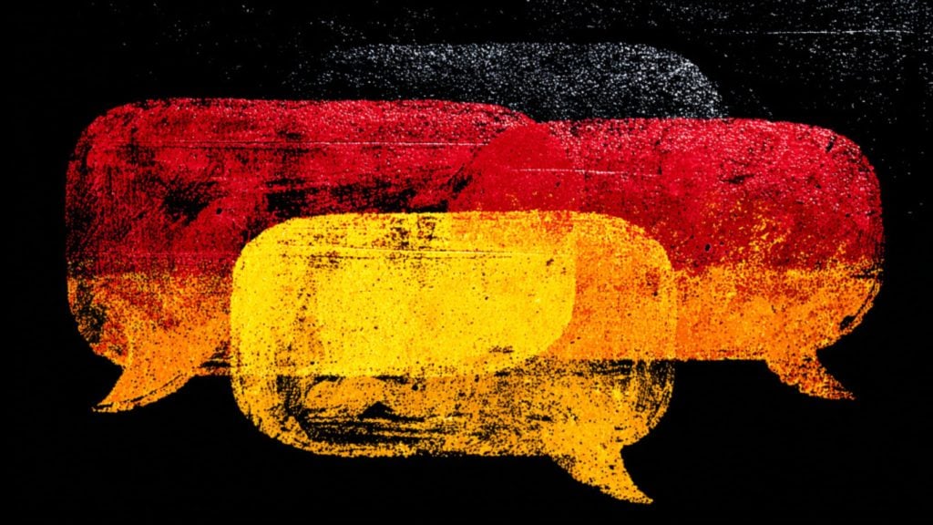 Three grungy, textured speech bubbles in black, red, and yellow overlapping against a solid black background.