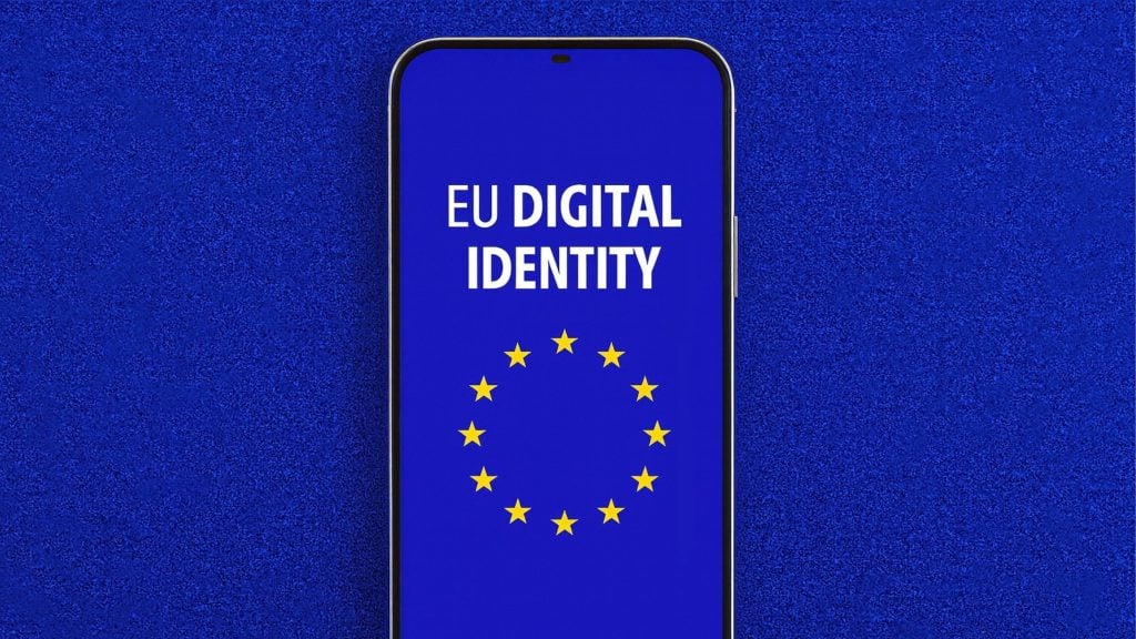 Smartphone centered on a textured blue background showing the words EU DIGITAL IDENTITY above a circle of twelve yellow stars like the EU flag.