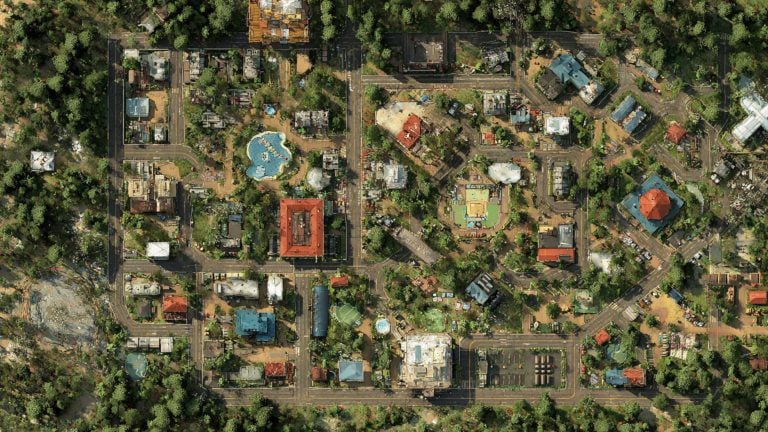 Aerial view of a compact, tree-lined neighborhood in a loose grid with roads and parking, mixed residential and civic buildings including a red-roofed square building, a blue-roofed octagonal pavilion, several swimming pools and playgrounds, and dense forest surrounding the area.