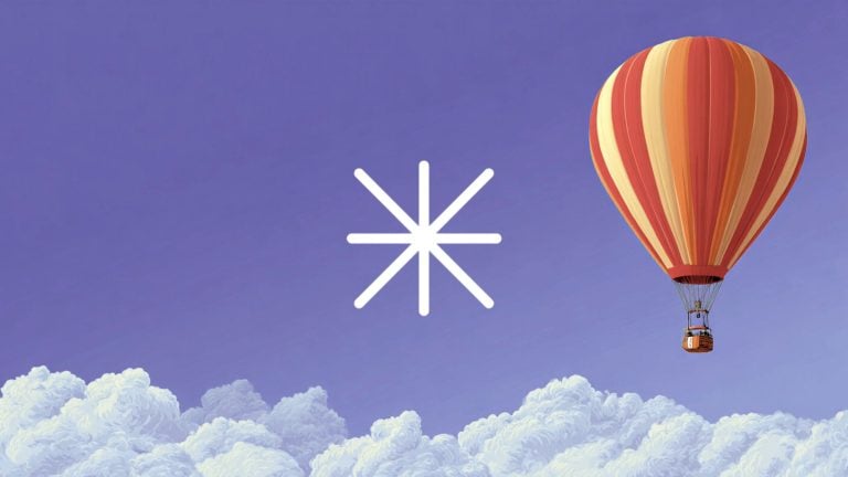 Red and orange hot-air balloon over fluffy clouds in a purple sky with a white star-like asterisk symbol at the center