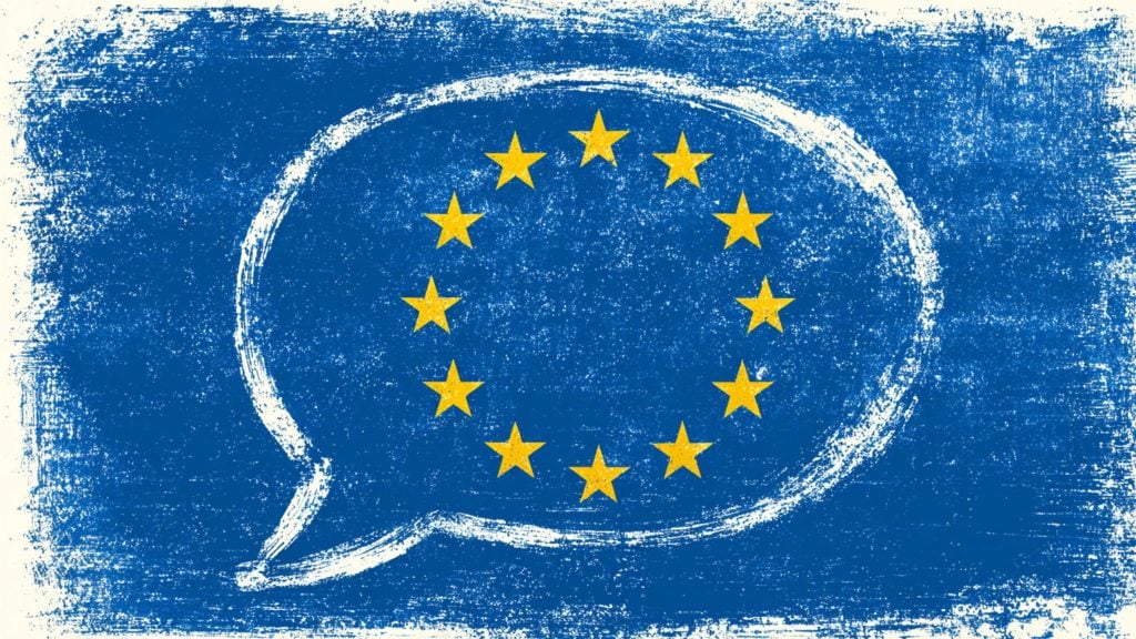 White sketched speech-bubble on a textured blue background with 12 yellow EU stars arranged in a circle.