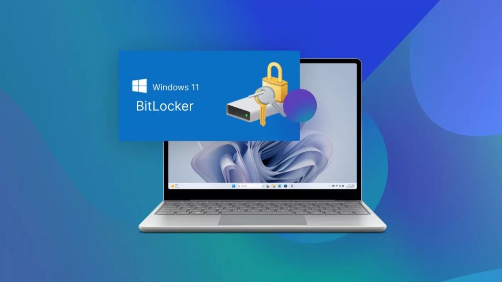 Laptop showing Windows 11 desktop with a blue BitLocker dialog featuring a locked drive icon, keys, and a padlock