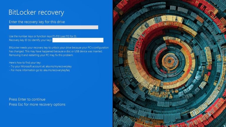 Windows BitLocker recovery blue screen with a recovery key prompt on the left and colorful concentric circular abstract wallpaper on the right.