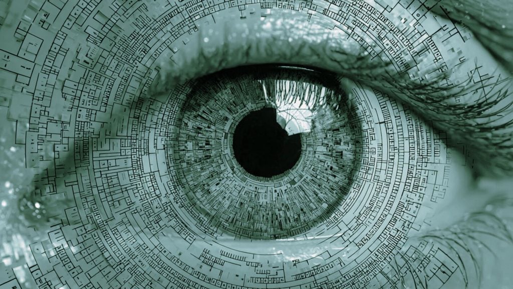 Close-up green-tinted eye with black pupil and concentric circuit-board style patterns radiating from the iris.