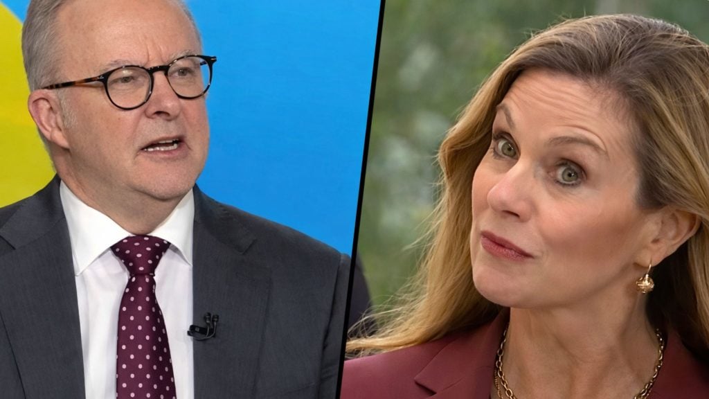 Split-screen close-up of Albanese in a suit with polka-dot tie beside Inman Grant in a maroon blazer raising an eyebrow