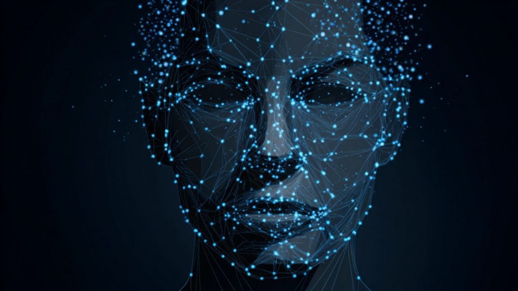 Abstract human face formed by blue glowing network nodes and connecting lines on a dark background.