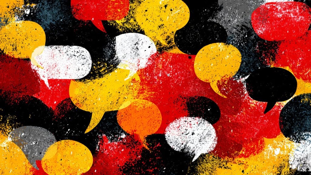 Grunge overlapping speech bubbles in red, yellow, black, white and gray with paint-splatter texture
