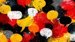Grunge overlapping speech bubbles in red, yellow, black, white and gray with paint-splatter texture