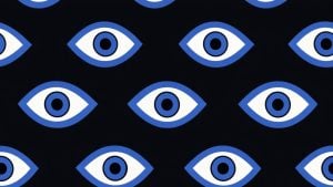 Repeating pattern of stylized blue-and-white eye shapes with concentric pupils on a black background.