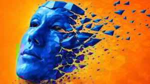 Blue low-poly human face breaking apart into floating triangular shards against a bright orange background.