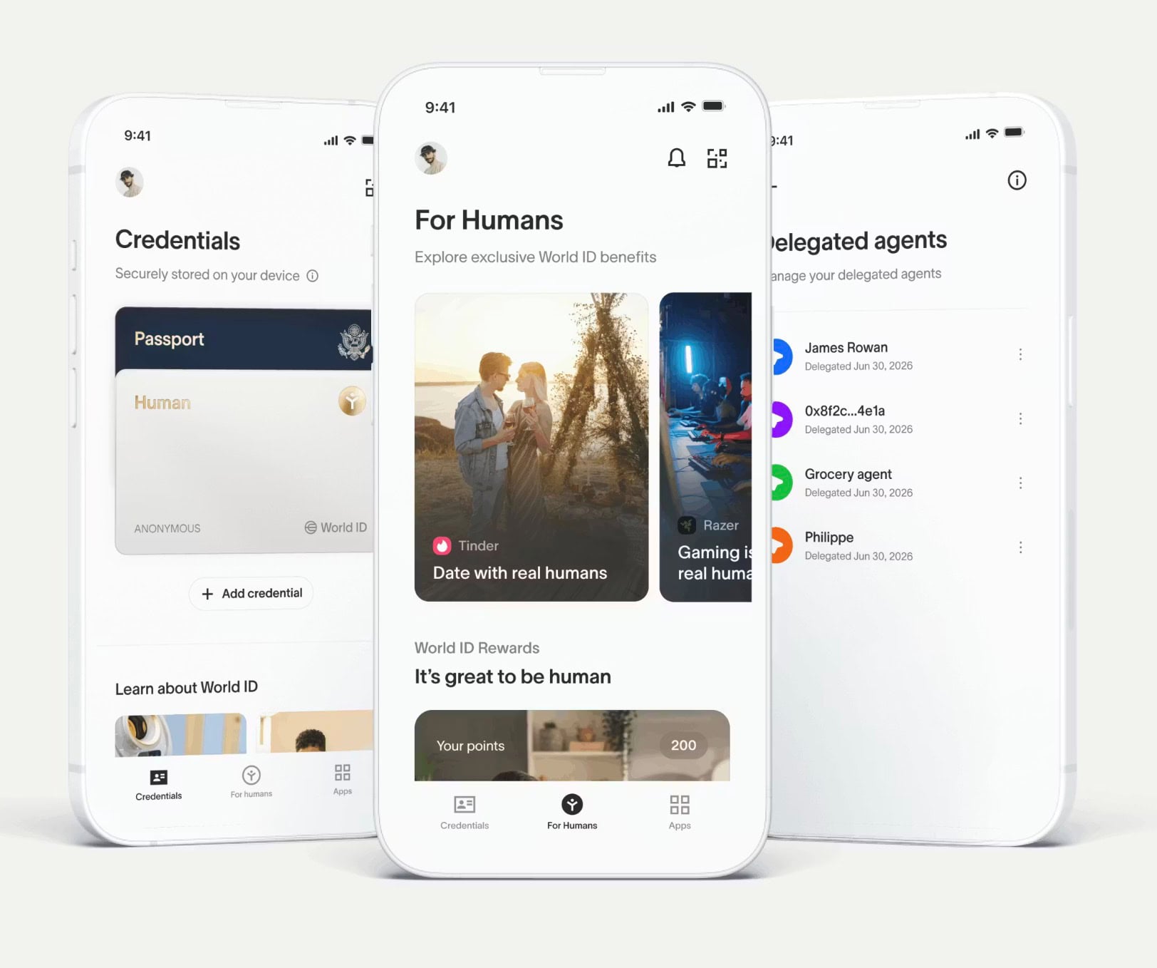 Three white smartphones showing a World ID app: credentials screen, a "For Humans" rewards feed with cards, and a delegated agents list.